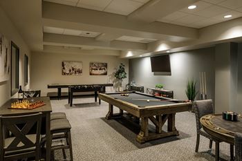 game room with pool table at Harbor Heights 55+ Community, Olympia